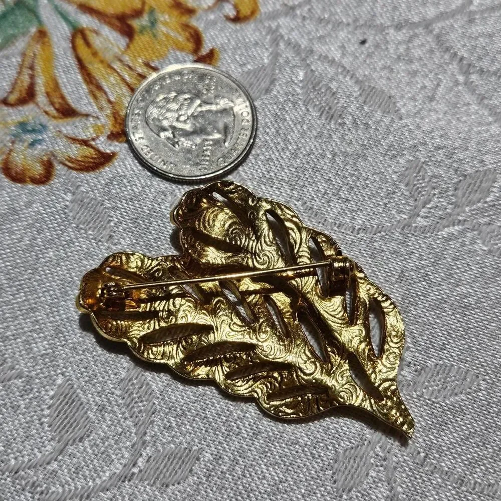 vintage boho cottagecore feather gold tone blue rhinestones brooch